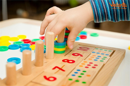 Child playing with numbers to improve number sense